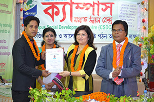 Managing Director of Microsoft Bangladesh, Sonia Bashir Kabir, is giving                      Certificates to the Trainees of Free Computer Training (Batch 131) as Chief Guest;  Dr. M Helal is presiding over. (2014)